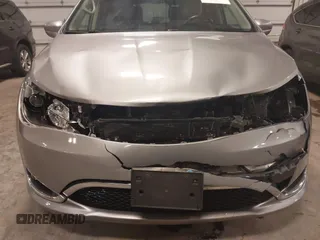 2018 Chrysler Pacifica Touring L with VIN 2C4RC1BG3JR330401, listed as a IAAI auction lot 41250303 with 86,975 mi miles and . Bid and sale history available at DreamBid. Image 6.