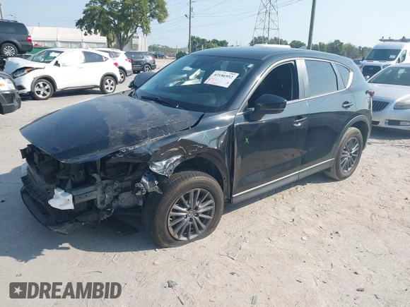 2020 Mazda CX-5 Touring with VIN JM3KFACM2L0770241, listed as a IAAI auction lot 42186952 with 41,590 mi miles and . Bid and sale history available at DreamBid. Image 2.