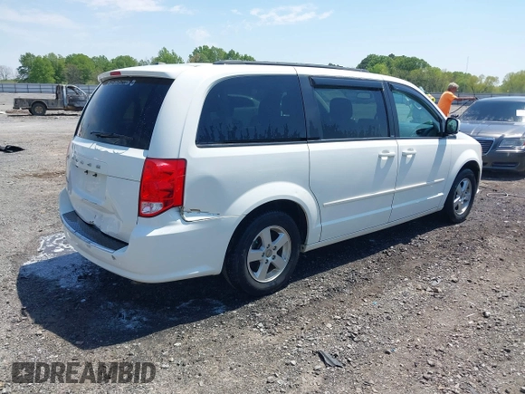 2012 Dodge Grand Caravan SXT with VIN 2C4RDGCG9CR200432, listed as a IAAI auction lot 42027477 with 99,076 mi miles and . Bid and sale history available at DreamBid. Image 4.