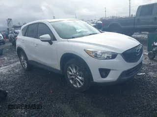 2015 Mazda CX-5 Grand Touring with VIN JM3KE4DY0F0483037, listed as a IAAI auction lot 41578222 with 102,988 mi miles. Bid and sale history available at carsss.com. Image 1.
