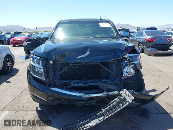 2015 Chevrolet Tahoe LTZ z VIN 1GNSKCKC7FR715512, wystawiony jako IAAI lot #42054583 z przebiegiem 106 941 mil mil oraz . Historia ofert i sprzedaży dostępna na DreamBid. Obrazek 12.
