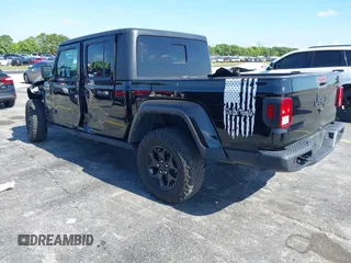 2021 Jeep Gladiator Willys with VIN 1C6HJTAGXML613431, listed as a IAAI auction lot 42180502 with 64,572 mi miles and . Bid and sale history available at DreamBid. Image 3.