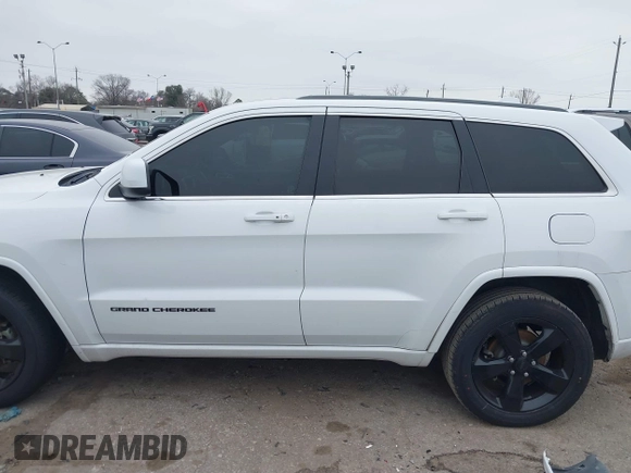 2015 Jeep Grand Cherokee Altitude with VIN 1C4RJEAG2FC901391, listed as a IAAI auction lot 41565763 with 220,685 mi miles. Bid and sale history available at carsss.com. Image 14.