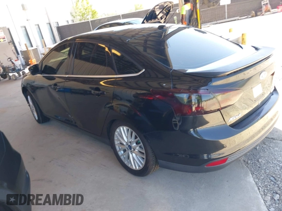 2013 Ford Focus Titanium with VIN 1FADP3J20DL143491, listed as a IAAI auction lot 42034388 with 194,388 mi miles and . Bid and sale history available at carsss.com. Image 3.