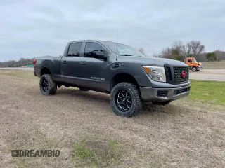 2016 Nissan Titan SV with VIN 1N6BA1F31GN517461, listed as a Copart auction lot 63161765 with 103,594 mi miles and Clean title. Bid and sale history available at DreamBid. Image 1.