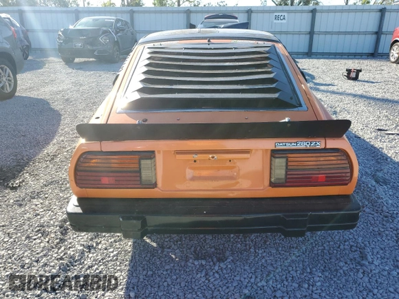 1983 Datsun 280ZX z VIN JN1HZ04S1DX572036, wystawiony jako Copart lot #76533294 z przebiegiem 172 147 mil mil oraz Nie do naprawy. Historia ofert i sprzedaży dostępna na DreamBid. Obrazek 6.