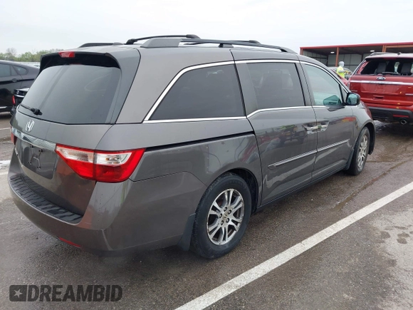 2012 Honda Odyssey EX-L with VIN 5FNRL5H6XCB032366, listed as a IAAI auction lot 41943625 with 73,236 mi miles and . Bid and sale history available at carsss.com. Image 4.