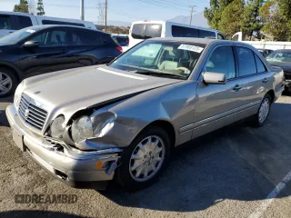 1998 Mercedes-Benz E-Class with VIN WDBJF65FXWA497997, listed as a Copart auction lot 87969125 with 145,322 mi miles and Salvage Title. Bid and sale history available at carsss.com. Image 1.