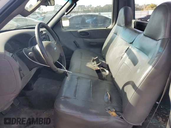 2003 Ford F-150 XL with VIN 1FTRF17W03NA39409, listed as a Copart auction lot 78578434 with 142,299 mi miles and Salvage Title. Bid and sale history available at DreamBid. Image 7.