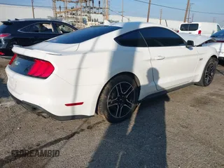 2021 Ford Mustang GT with VIN 1FA6P8CF1M5110879, listed as a IAAI auction lot 41451066 with 61,243 mi miles and . Bid and sale history available at DreamBid. Image 4.