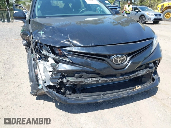 2020 Toyota Camry LE with VIN 4T1C11AK9LU387012, listed as a IAAI auction lot 42103647 with 64,049 mi miles and . Bid and sale history available at carsss.com. Image 6.
