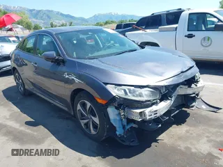 2020 Honda Civic LX with VIN 19XFC2F66LE021388, listed as a IAAI auction lot 42406333 with 57,928 mi miles and . Bid and sale history available at DreamBid. Image 1.