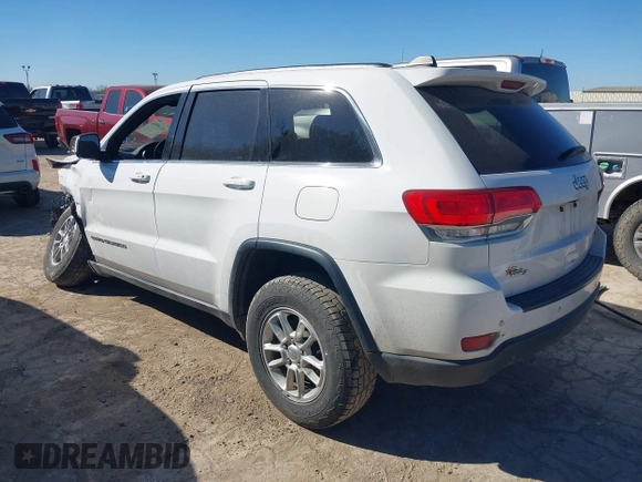 2018 Jeep Grand Cherokee Laredo E with VIN 1C4RJEAG2JC428990, listed as a IAAI auction lot 41218996 with 123,758 mi miles. Bid and sale history available at carsss.com. Image 3.