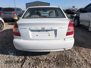 2000 Hyundai Accent z VIN KMHCG45G0YU084004, wystawiony jako Copart lot #42980585 z przebiegiem 167 545 mil mil oraz Czysty tytuł • Clean title. Historia ofert i sprzedaży dostępna na DreamBid. Obrazek 6.