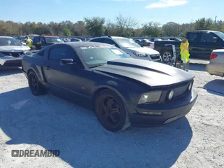 2005 Ford Mustang Deluxe with VIN 1ZVFT80N655136118, listed as a IAAI auction lot 41811969 with 104,071 mi miles. Bid and sale history available at carsss.com. Image 1.