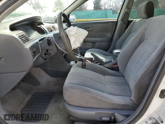 2000 Toyota Camry CE z VIN JT2BG22K2Y0479735, wystawiony jako Copart lot #50226755 z przebiegiem 282 694 mil mil oraz Nie do naprawy • Non repairable. Historia ofert i sprzedaży dostępna na DreamBid. Obrazek 7.