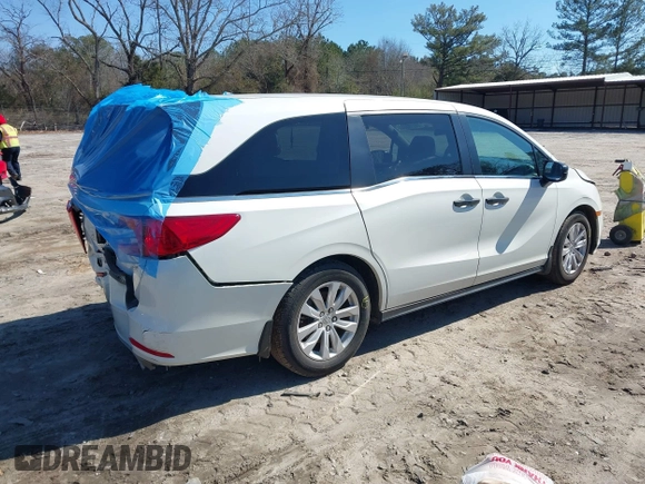 2019 Honda Odyssey LX with VIN 5FNRL6H23KB049236, listed as a IAAI auction lot 41633339 with 96,000 mi miles and . Bid and sale history available at DreamBid. Image 4.