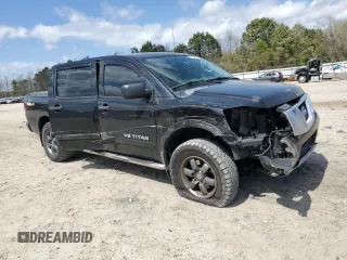 2015 Nissan Titan Pro-4X with VIN 1N6BA0EC1FN507491, listed as a Copart auction lot 51240915 with 165,510 mi miles and Salvage title. Bid and sale history available at DreamBid. Image 4.
