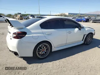 2015 Subaru WRX STI z VIN JF1VA2L64F9801006, wystawiony jako Copart lot #76352084 z przebiegiem 83 496 mil mil oraz Szkoda całkowita • Salvage title. Historia ofert i sprzedaży dostępna na DreamBid. Obrazek 3.