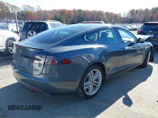 2013 Tesla Model S Performance with VIN 5YJSA1DP7DFP11737, listed as a IAAI auction lot 40915195 with Not provided miles and . Bid and sale history available at DreamBid. Image 4.