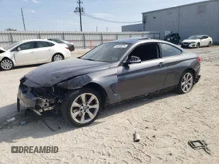 2014 BMW 4 Series 435i xDrive with VIN WBA3R5C5XEF730202, listed as a Copart auction lot 44045975 with 128,838 mi miles and Salvage Title. Bid and sale history available at carsss.com. Image 1.