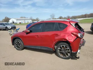 2016 Mazda CX-5 Grand Touring z VIN JM3KE2DY2G0705650, wystawiony jako Copart lot #53808365 z przebiegiem 123 611 mil mil oraz Szkoda całkowita • Salvage title. Historia ofert i sprzedaży dostępna na DreamBid. Obrazek 2.
