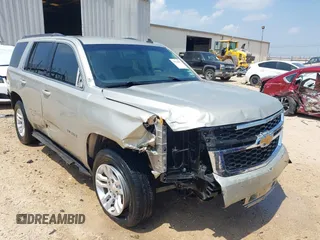 2015 Chevrolet Tahoe LS with VIN 1GNSCAKC9FR294832, listed as a IAAI auction lot 39274877 with 126,932 mi miles and . Bid and sale history available at DreamBid. Image 1.