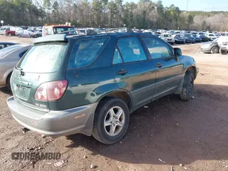 1999 Lexus RX 300 Luxury SUV with VIN JT6GF10U9X0027625, listed as a IAAI auction lot 41267869 with 1 mi miles. Bid and sale history available at carsss.com. Image 4.