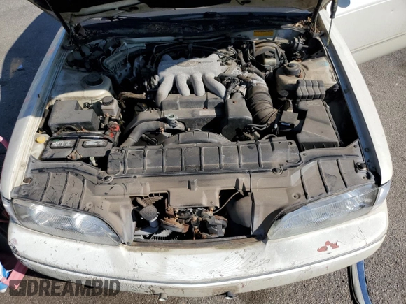 1994 Infiniti Q45 z VIN JNKNG01D3RM252218, wystawiony jako Copart lot #77230944 z przebiegiem 69 069 mil mil oraz Czysty tytuł • Clean title. Historia ofert i sprzedaży dostępna na DreamBid. Obrazek 11.
