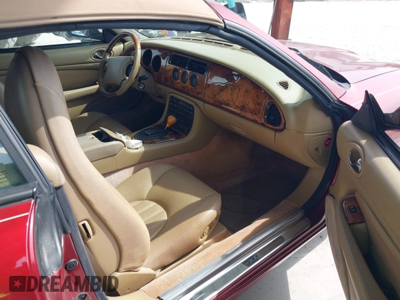 1997 Jaguar XK with VIN SAJGX274XVC004952, listed as a IAAI auction lot 42211023 with 109,889 mi miles and . Bid and sale history available at DreamBid. Image 5.