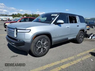 2024 Rivian R1S Adventure with VIN 7PDSGBBA4RN036045, listed as a Copart auction lot 74982414 with 9,256 mi miles and Salvage Title. Bid and sale history available at carsss.com. Image 1.