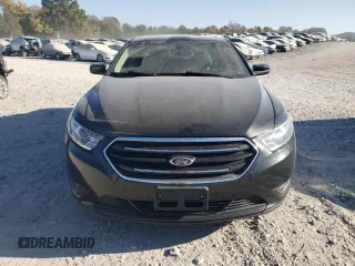 2015 Ford Taurus SEL with VIN 1FAHP2E90FG148821, listed as a Copart auction lot 77557384 with 141,514 mi miles and Salvage Title. Bid and sale history available at DreamBid. Image 5.
