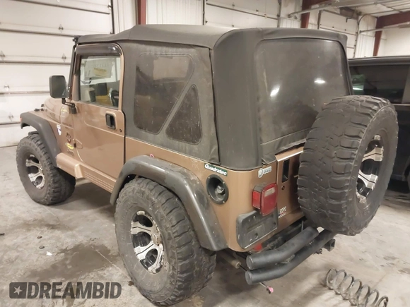2000 Jeep Wrangler Sahara with VIN 1J4FA59S2YP740431, listed as a IAAI auction lot 41313079 with 183,989 mi miles. Bid and sale history available at carsss.com. Image 3.