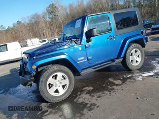 2009 Jeep Wrangler Sahara z VIN 1J4FA54199L722192, wystawiony jako IAAI lot #41619305 z przebiegiem 105 545 mil mil oraz . Historia ofert i sprzedaży dostępna na DreamBid. Obrazek 20.