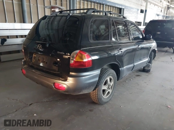 2004 Hyundai Santa Fe GLS with VIN KM8SC13E74U666943, listed as a IAAI auction lot 41616623 with 196,665 mi miles. Bid and sale history available at carsss.com. Image 4.
