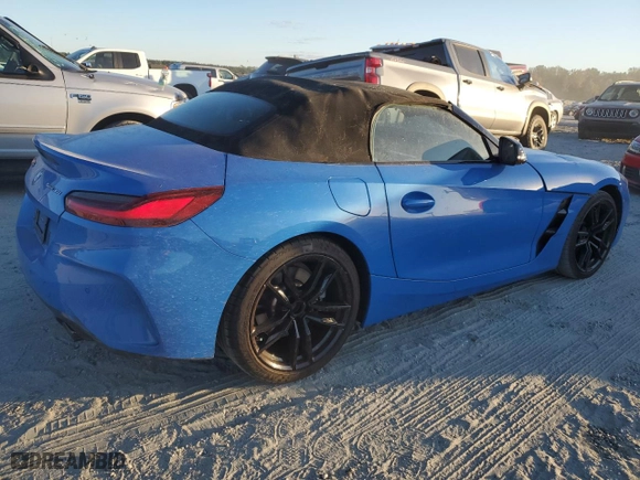 2022 BMW Z4 sDrive30i with VIN WBAHF3C02NWX38818, listed as a Copart auction lot 76604404 with 16,402 mi miles and Salvage Title. Bid and sale history available at carsss.com. Image 3.