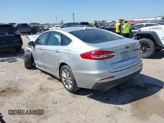 2019 Ford Fusion SE with VIN 3FA6P0LU1KR222141, listed as a IAAI auction lot 42000677 with 122,898 mi miles and . Bid and sale history available at carsss.com. Image 3.