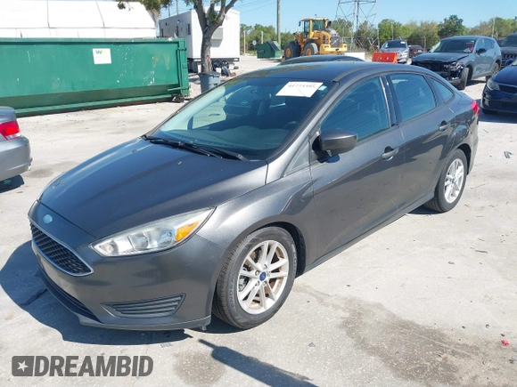 2018 Ford Focus SE z VIN 1FADP3F27JL245603, wystawiony jako IAAI lot #41773395 z przebiegiem 94 044 mil mil oraz . Historia ofert i sprzedaży dostępna na DreamBid. Obrazek 17.