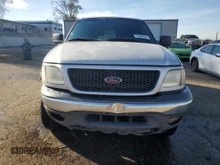 2002 Ford F-150 XLT with VIN 1FTRW08L12KA86849, listed as a Copart auction lot 77861574 with 0 mi miles and Salvage Title. Bid and sale history available at carsss.com. Image 5.