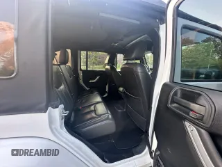 2016 Jeep Wrangler Unlimited Sahara with VIN 1C4BJWEG5GL215915, listed as a Copart auction lot 61690145 with 143,925 mi miles and Clean title. Bid and sale history available at DreamBid. Image 6.