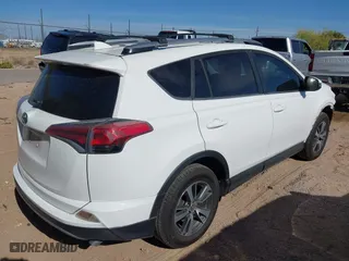 2017 Toyota RAV4 XLE with VIN JTMRFREV5HJ123412, listed as a IAAI auction lot 42018549 with 127,974 mi miles. Bid and sale history available at carsss.com. Image 4.
