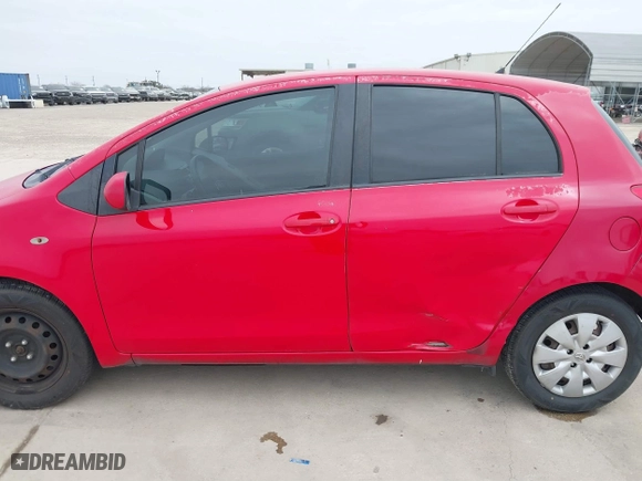 2009 Toyota Yaris with VIN JTDKT903295244022, listed as a IAAI auction lot 41615570 with 165,964 mi miles. Bid and sale history available at carsss.com. Image 14.