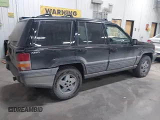 1995 Jeep Grand Cherokee Laredo with VIN 1J4GZ58S6SC765863, listed as a IAAI auction lot 41797726 with 234,715 mi miles and . Bid and sale history available at DreamBid. Image 4.