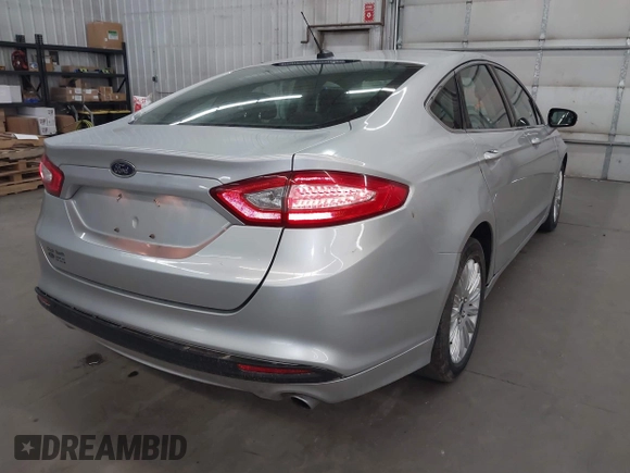 2013 Ford Fusion SE Hybrid with VIN 3FA6P0LU7DR228691, listed as a IAAI auction lot 42055540 with 144,389 mi miles and . Bid and sale history available at DreamBid. Image 4.