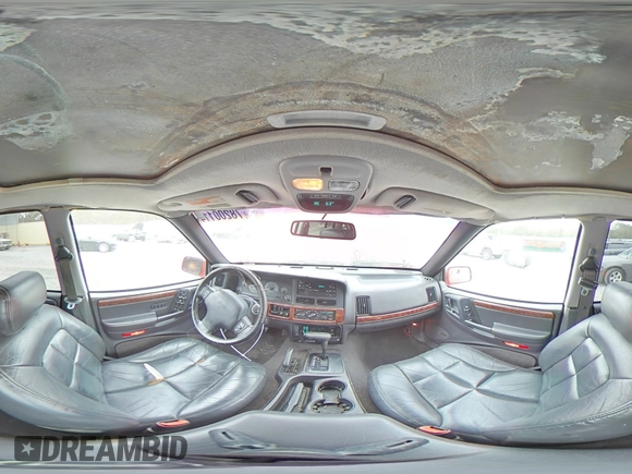 1998 Jeep Grand Cherokee Limited z VIN 1J4GZ78S0WC276411, wystawiony jako Copart lot #78200114 z przebiegiem 220 856 mil mil oraz Szkoda całkowita • Salvage title. Historia ofert i sprzedaży dostępna na DreamBid. Obrazek 13.