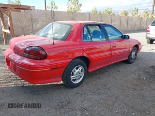 1996 Pontiac Grand Am SE with VIN 1G2NE52T7TC851196, listed as a IAAI auction lot 41700021 with 250,393 mi miles. Bid and sale history available at carsss.com. Image 4.