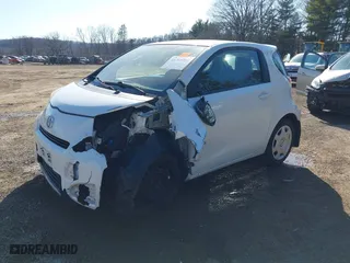 2012 Scion iQ with VIN JTNJJXB08CJ011734, listed as a IAAI auction lot 41769409 with 75,931 mi miles. Bid and sale history available at carsss.com. Image 2.