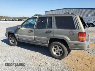 1998 Jeep Grand Cherokee Laredo with VIN 1J4GZ58S5WC165213, listed as a Copart auction lot 77611434 with 168,688 mi miles and Salvage Title. Bid and sale history available at carsss.com. Image 2.