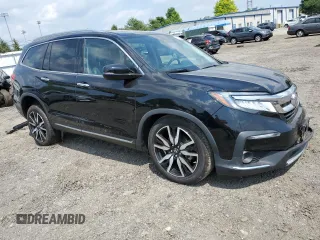2020 Honda Pilot Touring 8-Passenger with VIN 5FNYF5H95LB021658, listed as a Copart auction lot 58878594 with 36,122 mi miles and Salvage Title. Bid and sale history available at DreamBid. Image 4.