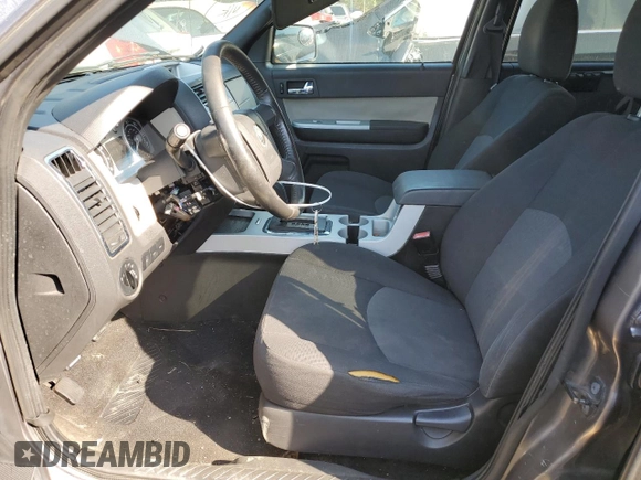 2009 Mercury Mariner with VIN 4M2CU81G69KJ18657, listed as a Copart auction lot 68869154 with 186,290 mi miles and Salvage title. Bid and sale history available at DreamBid. Image 7.